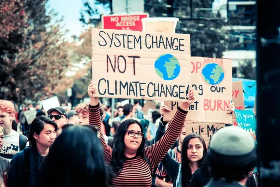 sign with system change not climate change